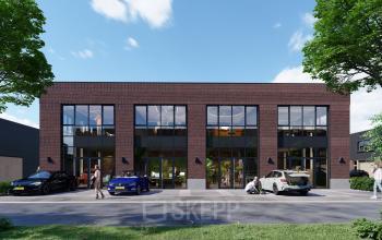 Exterieur van kantoorpand op Spaceshuttle 18C, Amersfoort Calveen. Moderne bakstenen gevel met grote ramen en enkele voertuigen geparkeerd voor het gebouw. Geschikt voor kantoorruimte huren.