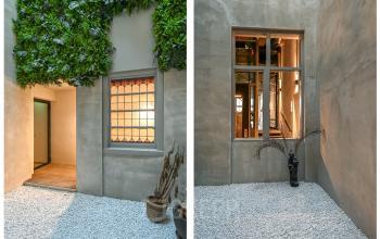 Binnenplaats van kantoor op Prins Hendrikkade 48 A, Amsterdam Centrum, met ramen en groene accenten. Ideaal voor bedrijven die een uniek kantoorpand willen huren.