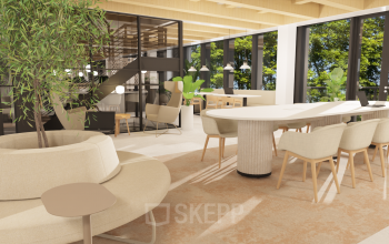 Kantoorruimte huren in Amsterdam Centrum met moderne inrichting, lichte meubels en veel natuurlijk licht. Kantoorpand met open indeling en groene accenten.