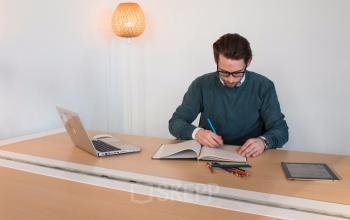 Office desk with chair, lightning and screen