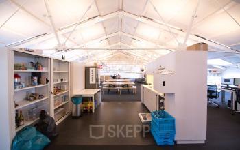big open office space with storage room and pantry