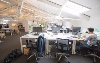 office space with lots of working desks