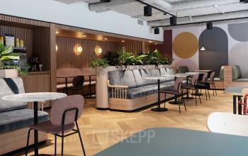 Modern ingerichte lounge van een kantoorgebouw aan de Overschiestraat 65, Amsterdam Nieuw-West, met comfortabele zitplaatsen en sfeervolle verlichting.