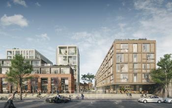 Een modern kantoorpand gelegen aan de Papaverhof 58 in Amsterdam Noord met mensen die fietsen en wandelen in de omgeving.