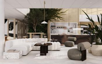 Moderne kantoorruimte huren aan de Laarderhoogtweg 7-19 in Amsterdam Zuid-Oost met stijlvolle, comfortabele meubels en groene accenten.