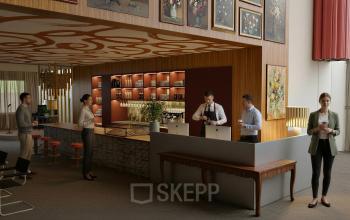 Moderne kantoorruimte huren in Amsterdam Zuidas, Barbara Strozzilaan 101-101, met een stijlvolle bar en mensen die aan het werk zijn.