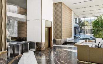 Moderne kantoorruimte met een stijlvolle lobby op Claude Debussylaan 80-134 in Amsterdam Zuidas, ideaal om een kantoor te huren. Het kantoorpand heeft een elegante receptie en hedendaags design.