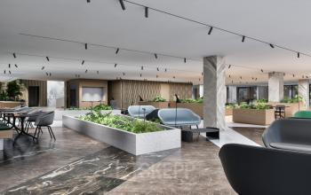 Moderne kantoorruimte te huur op Claude Debussylaan 80-134 in Amsterdam Zuidas, voorzien van stijlvolle inrichting en ruime opzet met veel groen en marmeren vloeren.