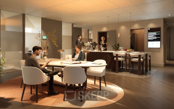 Moderne kantoorruimte huren op Claude Debussylaan 80-134 in Amsterdam Zuidas, met stijlvolle gemeubileerde werkplekken waar professionals zakelijke overleggen voeren.