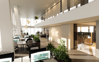 Moderne en lichte kantoorruimte aan de Claude Debussylaan in Amsterdam Zuidas, met open werkplekken, planten en mensen die aan het werk zijn.