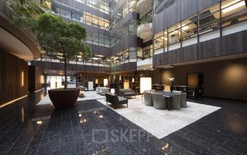 sociaalhart lounge stoelen werkplek bank plant open ruimte
