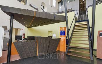 central reception desk at entrance of building