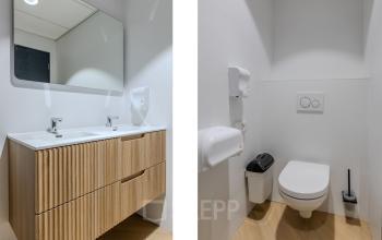 Moderne toiletruimte in kantoorpand op Rijtuigweg 10, Bergen op Zoom, met strak design en dubbele wastafel.