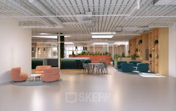 Moderne open kantoorruimte op Essebaan 63-69, Capelle aan den IJssel, met stijlvolle meubels en veel groen. Ideale plek om een kantoor te huren en productief te werken.