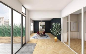 Modern kantoorpand met houten vloer, grote ramen, en een vergadertafel op Johan de Wittlaan 3-7, Den Haag Statenkwartier, ideaal voor kantoorruimte huren.