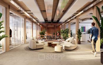 Modern ingericht kantoorpand op Moutlaan 1-23 in Enschede met zitgedeelte en planten. Mensen voeren zakelijke activiteiten uit.