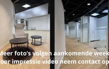 Interieur van een kantoorpand op Hoedemakerplein 2 in Enschede met modern ingericht werkruimte met glazen wanden en houten vloer. Kantoorruimte huren mogelijk.