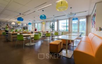 canteen with lots of tables and chairs lunchroom