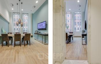 Kantoorruimte huren aan Blaak 34 in Rotterdam Centrum met moderne vergaderruimte, houten vloer en stijlvolle verlichting.