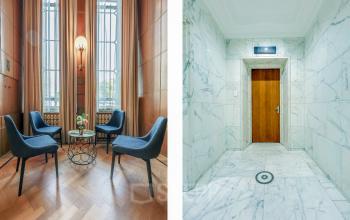 Stijlvolle ontvangstruimte met vier stoelen en een centraal tafeltje, gelegen in het kantoorpand Blaak 34 in Rotterdam Centrum.