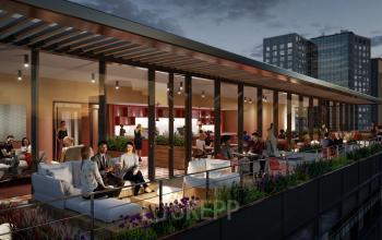 Gezellige, moderne kantoorruimte op Hoogstraat 185, Rotterdam Centrum, met mensen in een lounge met een panoramisch uitzicht. Ideaal voor vergaderingen en netwerken met de mogelijkheid om kantoorruimte te huren.