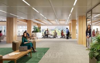 Ruime, moderne kantoorruimte op Coolsingel 75 in Rotterdam Centrum met gemeubileerde werkplekken en personen die zakelijke activiteiten uitvoeren.