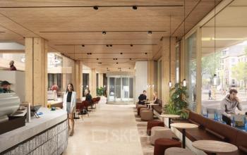 Moderne kantoorruimte huren aan de Coolsingel 75 in Rotterdam Centrum, met een open en lichte werkruimte waar mensen aan tafels zitten en zakelijke activiteiten uitvoeren.