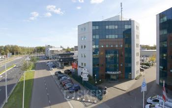 office building glass windows white parking spots