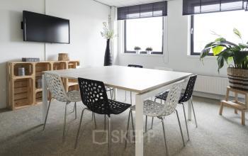 office room for rent in rotterdam white table