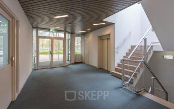 office building tilburg with stairs and blue carpet