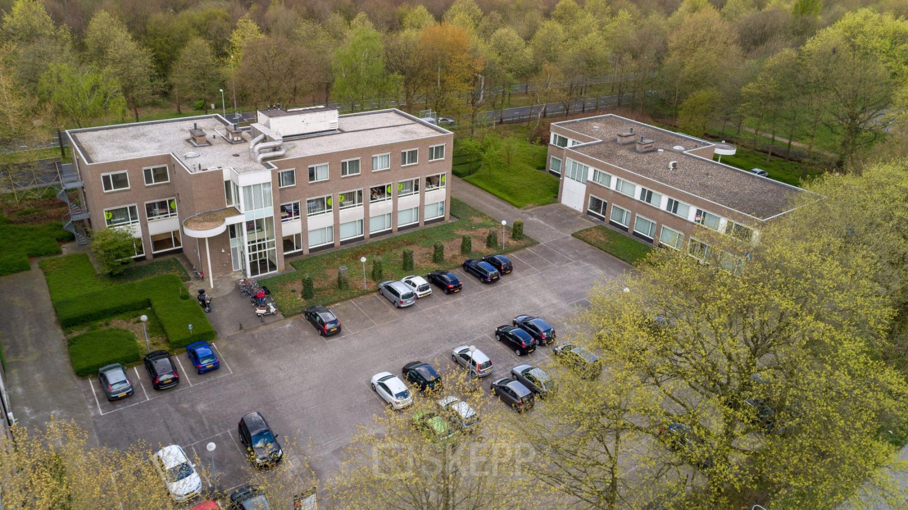 office building tilburg with parking spots