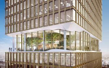 Moderne kantoorruimte huren in een opvallend kantoorpand op Stadsplateau 3, Utrecht Centraal Station, met een groene gevel en grote ramen, perfect voor een inspirerende werkomgeving.