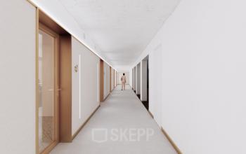 Heldere gang in het Moreelsepark 1 kantoorpand te Utrecht Centraal Station. Geen personen aanwezig. Geschikt voor het huren van kantoorruimtes.