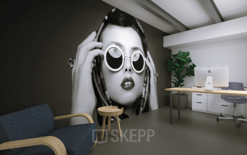 Moderne kantoorruimte huren aan Eendrachtlaan 100-260, Utrecht Zuid, met uniek muurontwerp, stijlvolle zithoek en werkplek met bureau en iMac.