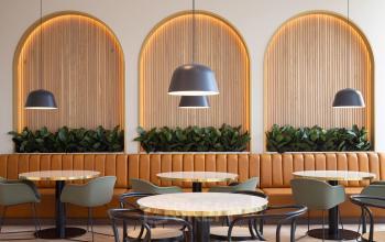 Moderne kantoorruimte op de Europalaan 40 in Utrecht Zuid met stijlvolle zithoeken en sfeervolle verlichting, ideaal voor zakelijke ontmoetingen of ontspannen werkmomenten. Voorzien van comfortabele stoelen en tafels in een gastvrije omgeving.