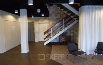 Office space with stairs in hallway